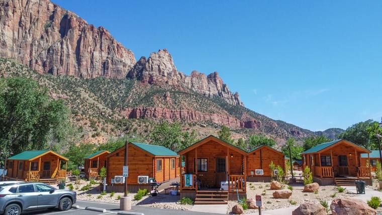 Cabin row with red rock backdrop